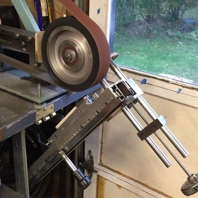 Surface grinder attachment for the belt grinder. The “magnetic chuck” is a $23 magnetic door lock.